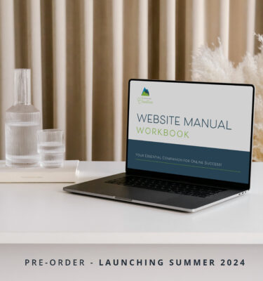 Laptop displaying a Website Manual Workbook (Pre-Order) advertisement on a desk, with a tagline for pre-order and a summer 2024 launch.