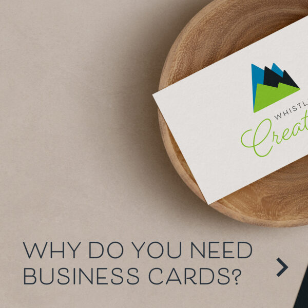 A business card featuring a mountain logo with the text "Whistler Creative" displayed on a wooden dish. Below, the text reads, "Why do you need Tree-Free Business Cards?