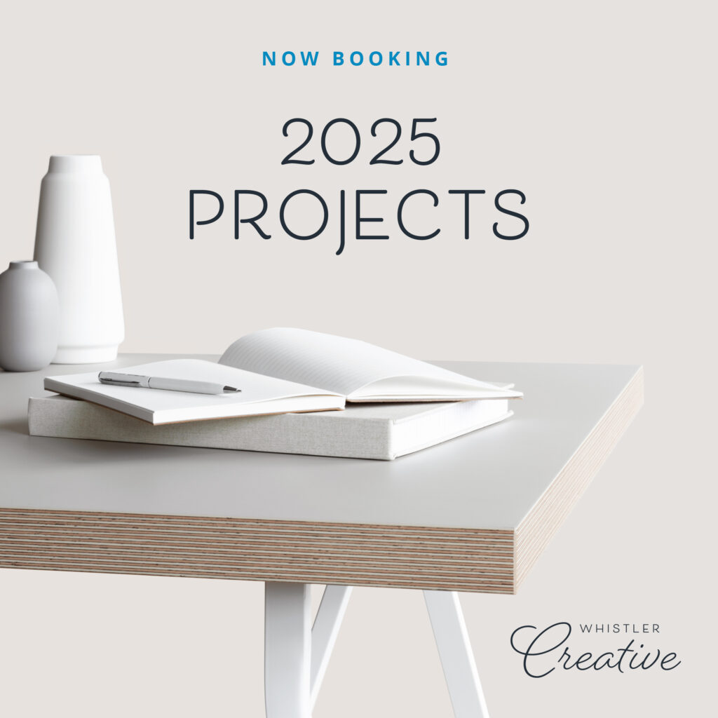 Minimalist desk featuring an open notebook, pencil, and vases. The text proudly announces, "Now Booking 2025 Projects," with the Whistler Creative logo elegantly displayed.